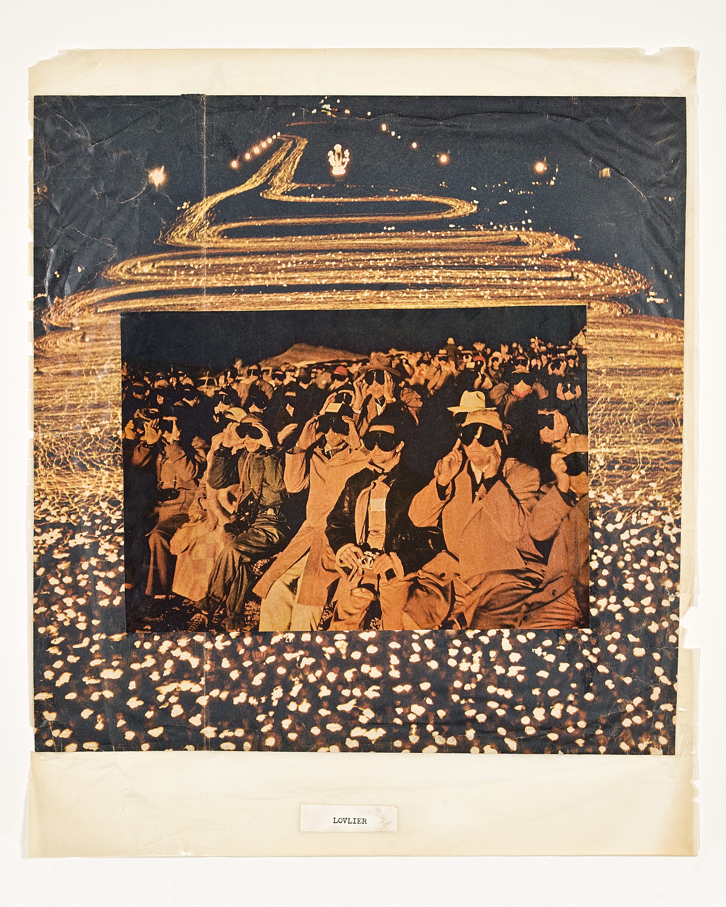 Winding image of lights on in the background with a rectangular image of a crowd wearing black eye masks pasted in the foreground. At the bottom, the word "lovelier."