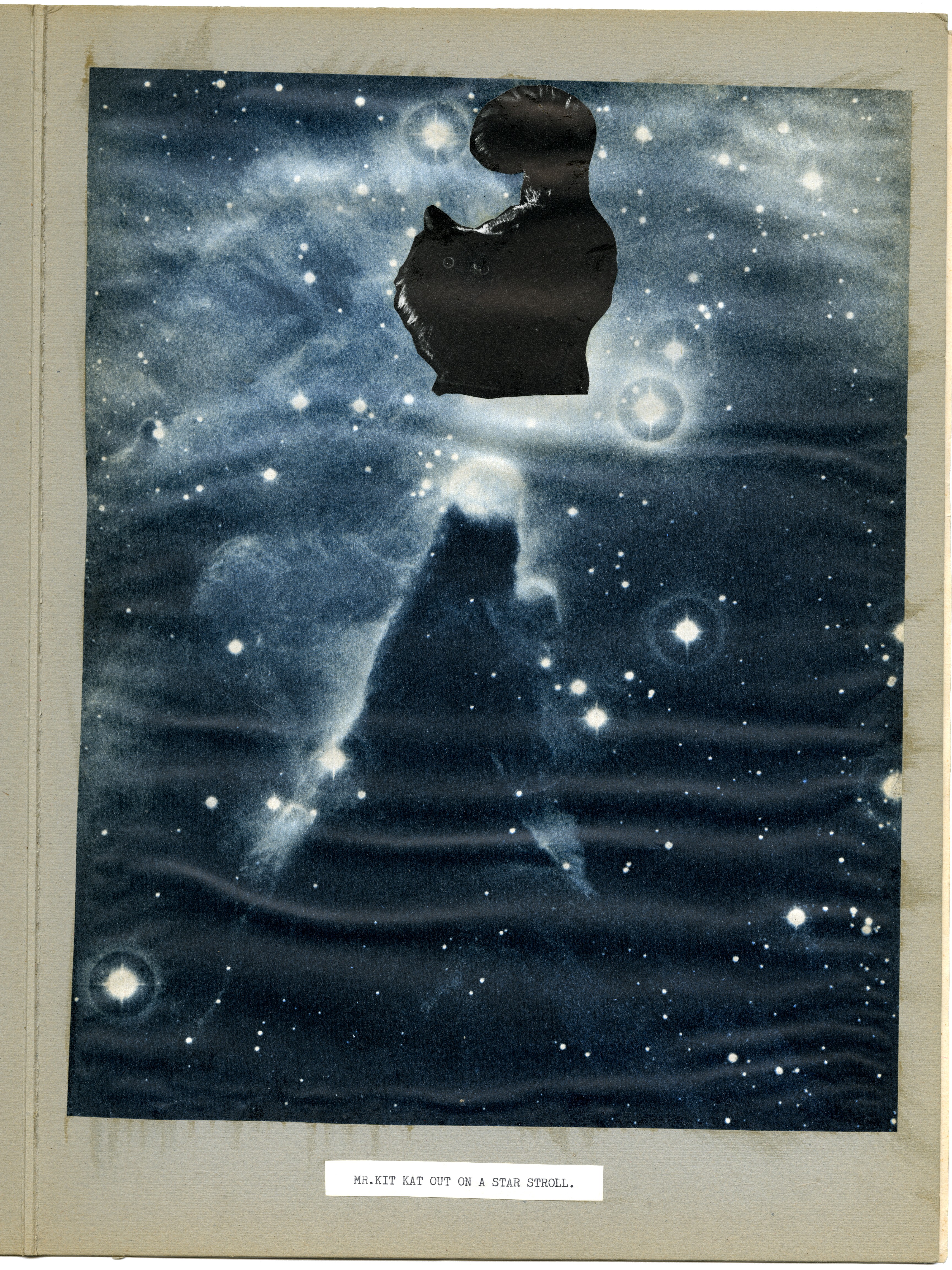 What appears to be an image of a galaxy and stars, with the image of a black cat with tail raised pasted at the top of the images. At the bottom, the words "MR. KIT KAT OUT ON A STAR STROLL."