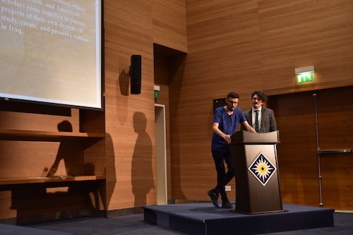 Zêdan Xelef reads a poem, with David Shook standing by to read its translation. Photo by Savan Ako.