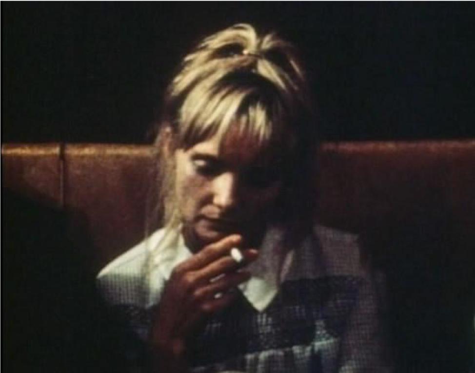 Film still from Barbara Loden’s WANDA, woman smoking cigarette.