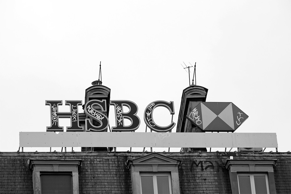 Photograph of graffiti on HSBC sign.