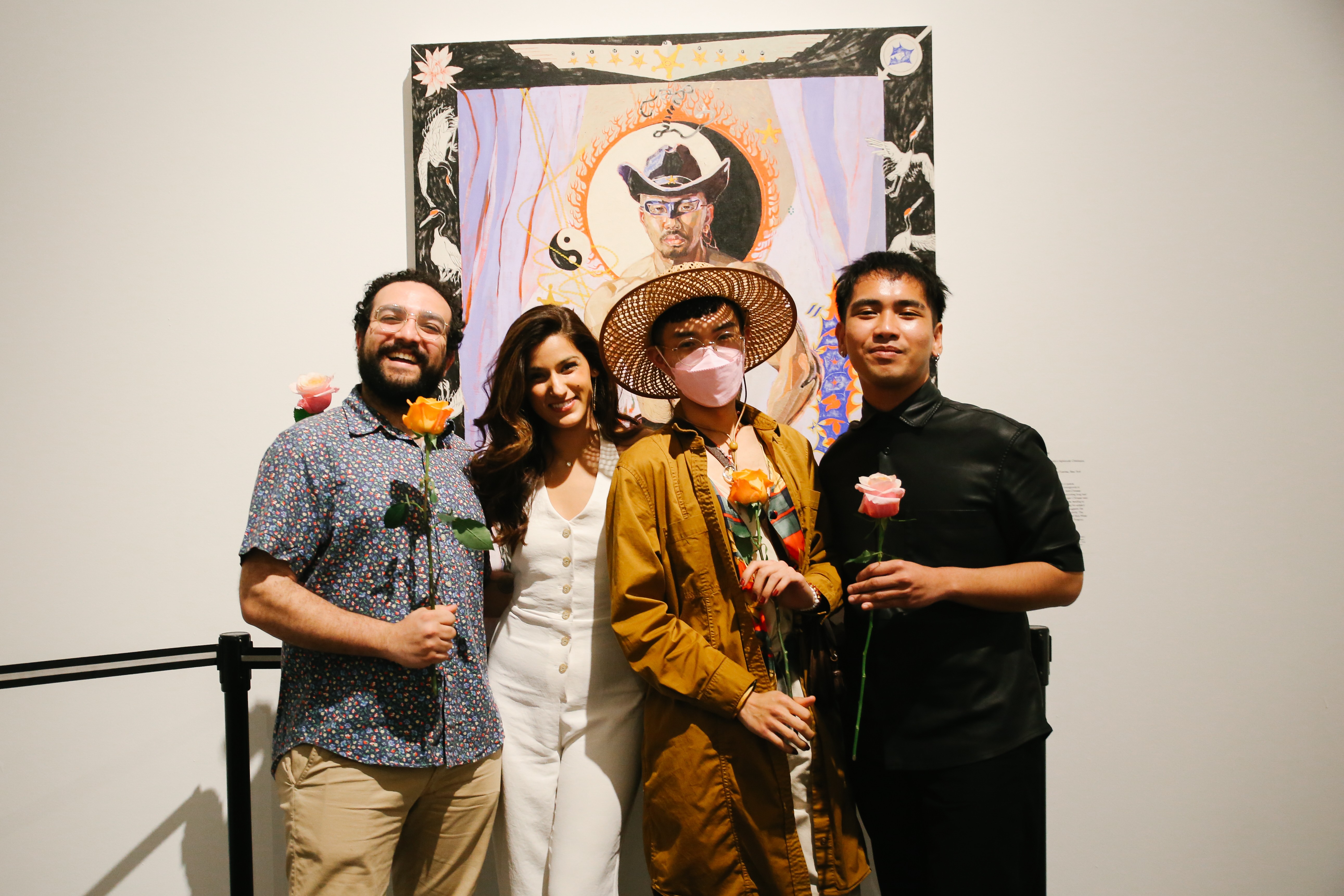 Hazem Fahmy, Kiran Bath, Wo Chan, and Elmo Tumbokon smile together in front of Oscar yi Hou’s artwork at the Brooklyn Museum after giving a reading at Brooklyn Museum’s First Saturdays.
