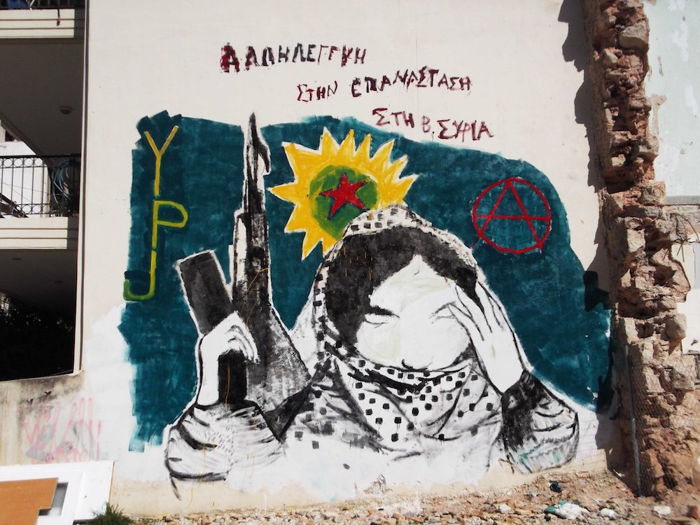 Political painting and graffiti in Athens, Greece.