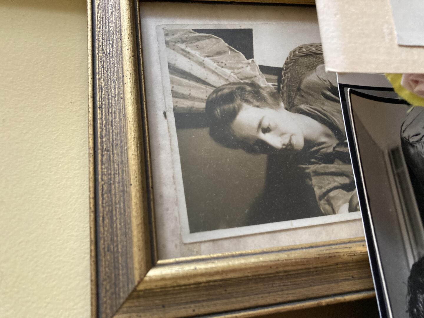 Color photo: Photos overlap a black and white photo of Elisabeth Stuart Wardwell in a gold frame